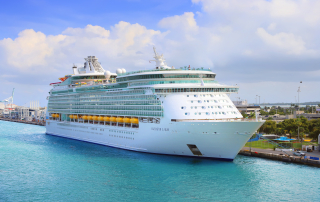 Cruise ship docked in Miami harbor, representing legal services for cruise ship injuries by Perkins Law Offices.