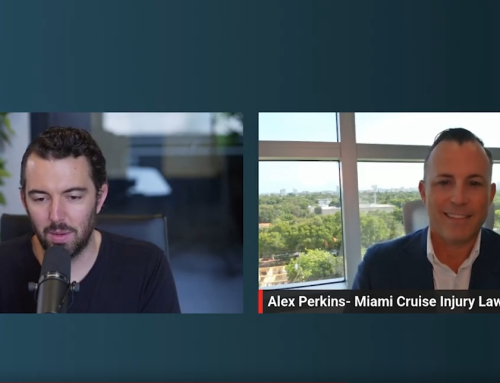 Alex Perkins, Miami cruise injury lawyer, speaking in a video interview with a co-host, discussing maritime law and cruise ship injury claims, with a cityscape view in the background.